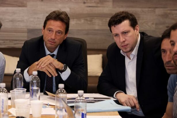 Moretti junto a Cigna en una reunión de CD