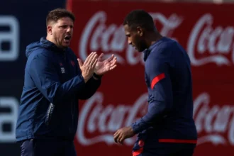 Damián Ayude y Jhohan Romaña en un entrenamiento